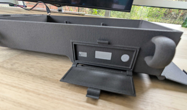 Print in place hinged cover to protect port